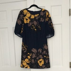 Short shift dress with puff sleeves.